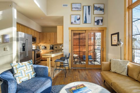 Sliding glass doors leading out to the main level balcony