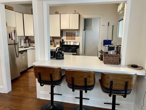 Connected dining room & kitchen with countertop seating