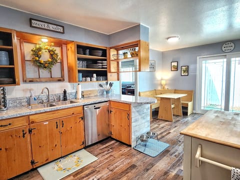 Kitchen has: dishwasher, oven/stove, fridge/freezer, coffee makers & microwave.