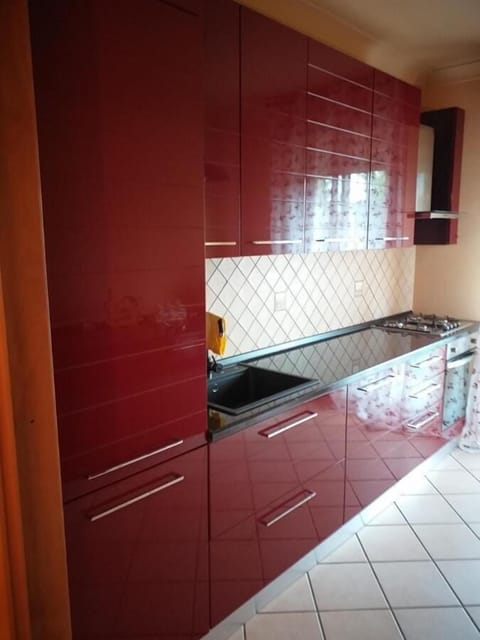 Apartment, 4 Bedrooms, Balcony, Garden View | Private kitchen | Stovetop, coffee/tea maker, electric kettle, dining tables