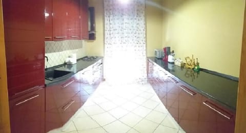 Apartment, 4 Bedrooms, Balcony, Garden View | Private kitchen | Stovetop, coffee/tea maker, electric kettle, dining tables