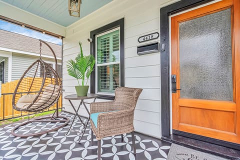 Front porch is picture perfect spot for relaxing and listening to the seabreeze.