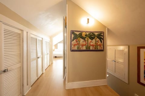 The upstairs consists of two bedrooms and a half bath. Lots of light in both bedrooms.