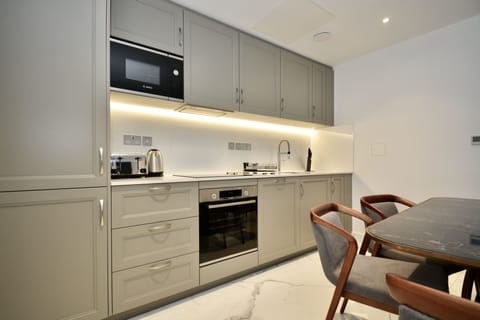 Luxury Apartment, 2 Bedrooms | Private kitchen | Full-size fridge, microwave, oven, stovetop