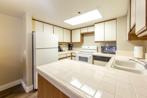 Suite, 2 Bedrooms | Private kitchen | Full-size fridge, microwave, oven, stovetop