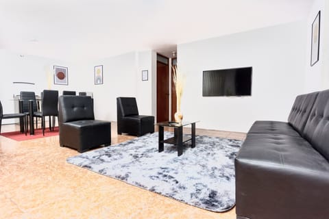 Executive Apartment | Living area | 50-inch Smart TV with digital channels, TV