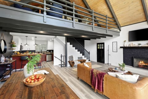 The lofted space overlooks the living room.