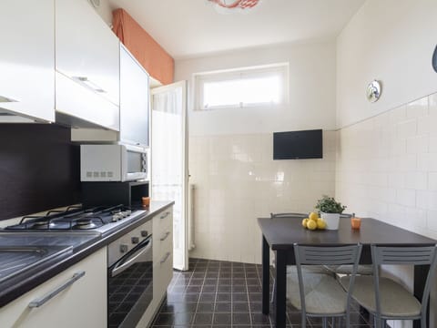 Property, Cabinetry, Countertop, Table, Building, Kitchen, Kitchen Stove, Interior Design, Wood, Flooring