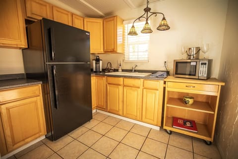 Deluxe Studio Suite, 1 King Bed, Pool View | Private kitchenette | Fridge, microwave, coffee/tea maker, toaster