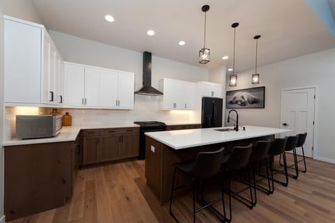 Kitchen fully stocked with cookware and bakeware.