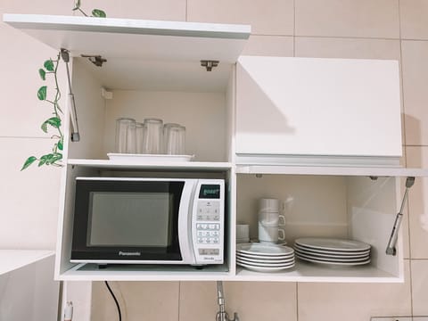 Fridge, microwave, cookware/dishes/utensils