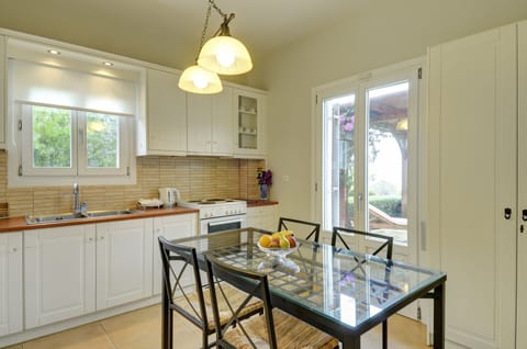 Exclusive Villa | Private kitchen | Full-size fridge, microwave, coffee/tea maker, electric kettle