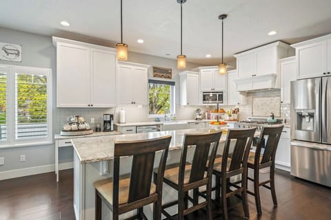 7. Ultra-modern kitchen with a large island and a breakfast bar for four.
