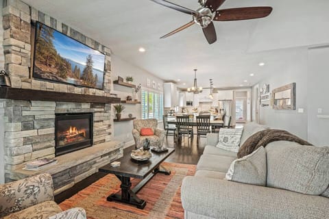 4. Living room with a sandstone gas fireplace. 