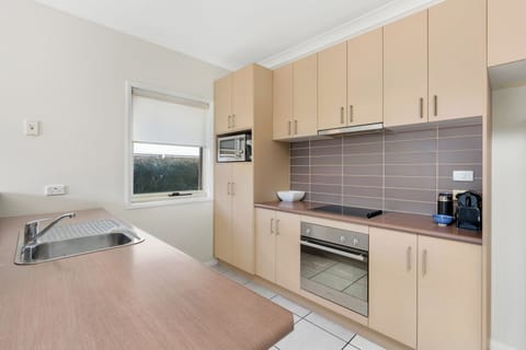 Executive One Bedroom Apartment | Private kitchen | Full-size fridge, microwave, oven, stovetop