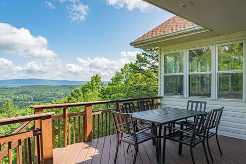 Enjoy outdoor dining with panoramic views on this covered deck—ideal for meals, conversations, and unforgettable moments.