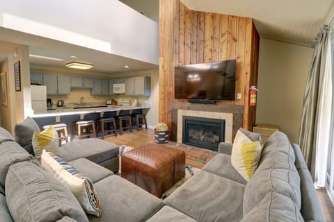 Cozy living room looking over to kitchen.