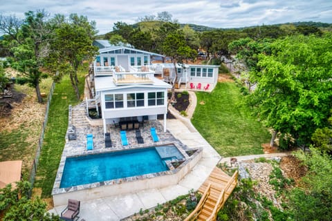 House sleeps 20 people. Roof top decks, lake views & poolside dining with BBQ.