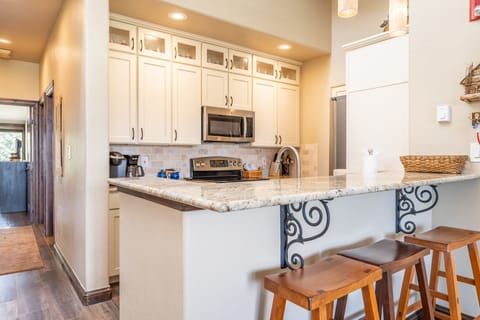 Breakfast bar with seating for three.