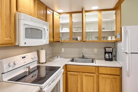 The kitchen comes fully stocked with silverware, pots and pans, and more