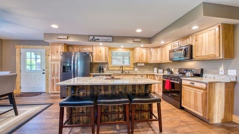 The bar area seats three, in addition to the kitchen table, which seats 4