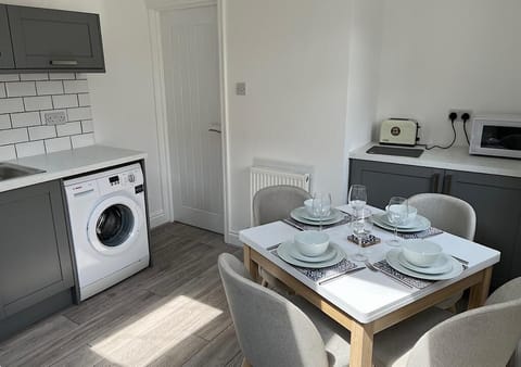 Kitchen and dining table, the table extends out to seat 6 if needed