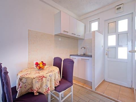 Studio (Studio Apartment with Balcony and Sea) | Private kitchen | Fridge, dining tables