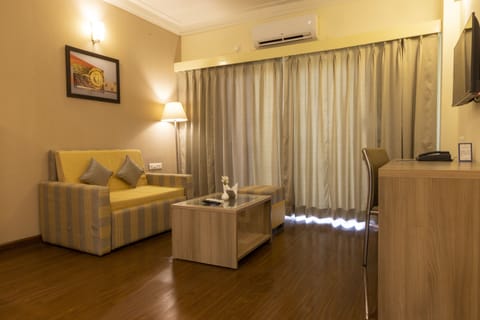 Premium Studio Suite, 1 Bedroom, City View | Living area | 32-inch LED TV with cable channels, TV