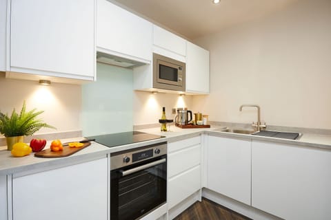 Superior Suite | Private kitchen | Fridge, microwave, stovetop, electric kettle