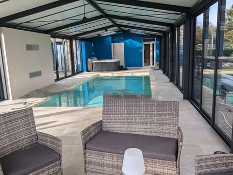 Indoor pool, a heated pool, sun loungers