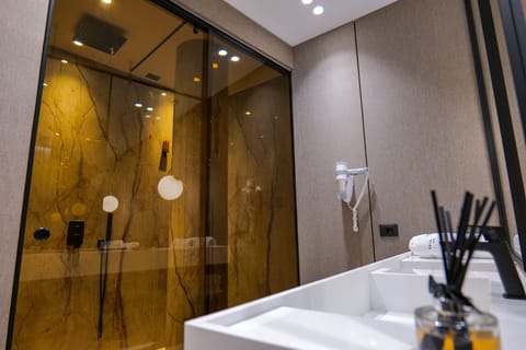 Superior Suite, Sea View | Bathroom | Hair dryer, slippers, towels