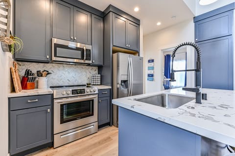 The fully stocked kitchen and large pantry will satisfy any culinary needs during your stay.