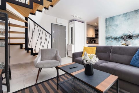 Living room with a comfortable sofa and TV. 