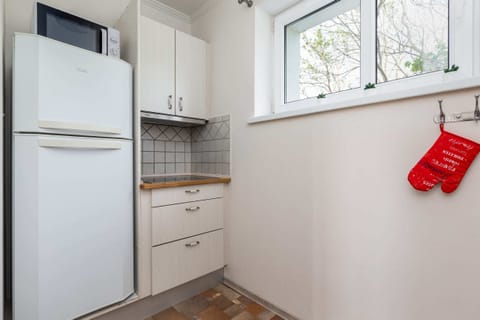 The kitchen is fully equipped with high-quality appliances for all your culinary needs.