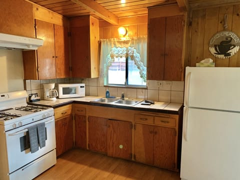 Family Cabin | Private kitchen | Coffee/tea maker, paper towels, dining tables