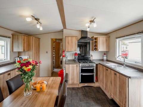 Flower, Property, Furniture, Table, Cabinetry, Countertop, Wood, Sink, Interior Design, Kitchen