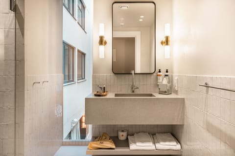 Standard Apartment | Bathroom | Shower, rainfall showerhead, designer toiletries, hair dryer