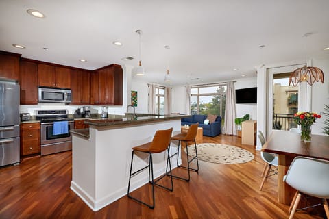 Kitchen, counter, dining and living room area
