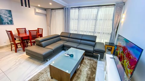 Deluxe Apartment | Living area | 32-inch flat-screen TV with satellite channels, TV