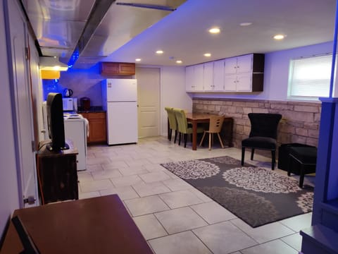 Fresh living room with fun color LED lighting and large SmartTV.