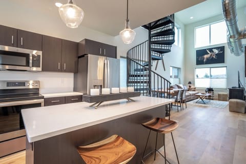 The flow from the kitchen, to the dining room, to the living room is one of our favorite things about this townhome | Main Level