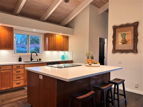 Renovated kitchen with spacious island and Silestone countertops