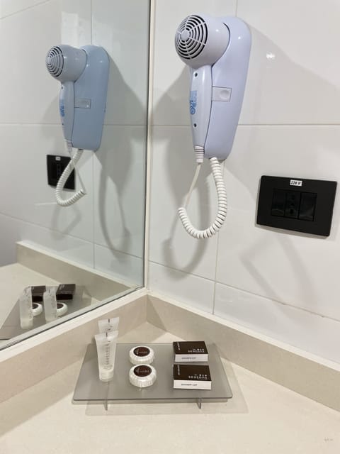 Bathtub, hair dryer, towels