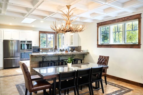 Dining room with large table and bar.