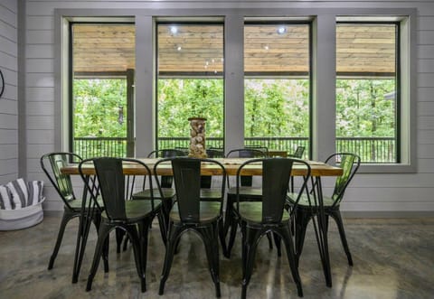 Share meals and stories around our spacious dining table, framed by tranquil views of the great outdoors."