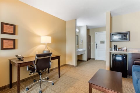 Premium bedding, desk, laptop workspace, blackout drapes