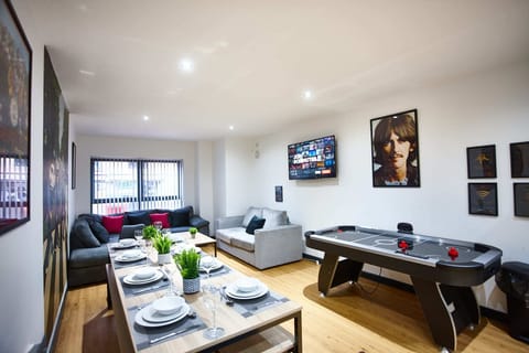 Dinning area with ice hockey table and living area