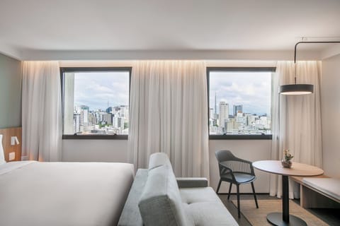 Premium Room, City View | Minibar, in-room safe, desk, blackout drapes