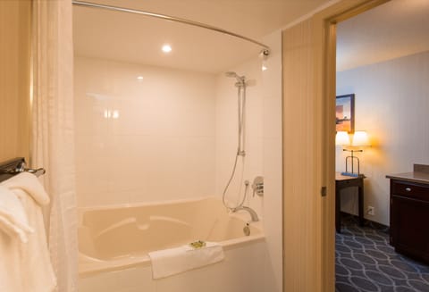 Premium Room, 1 King Bed, Jetted Tub (Not Pet Friendly) | Bathroom | Combined shower/tub, free toiletries, hair dryer, towels