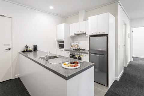 Two Bedroom Apartment | Private kitchen | Full-size fridge, microwave, oven, stovetop